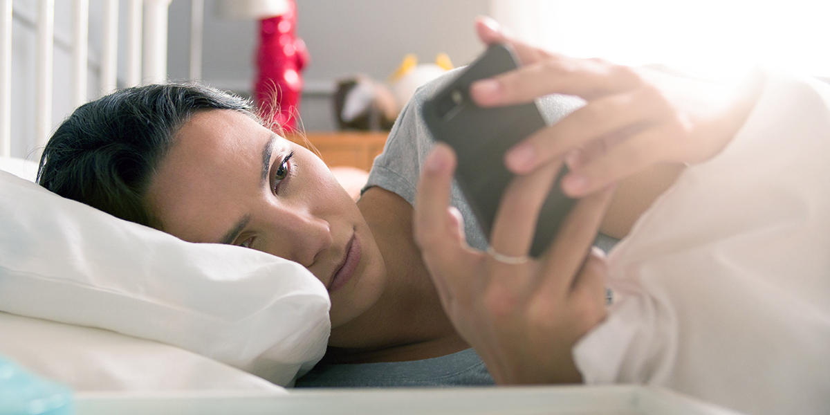 WOMAN CHECKING PHONE