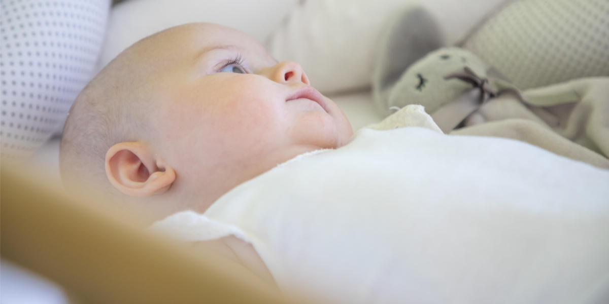 INFANT IN COT,