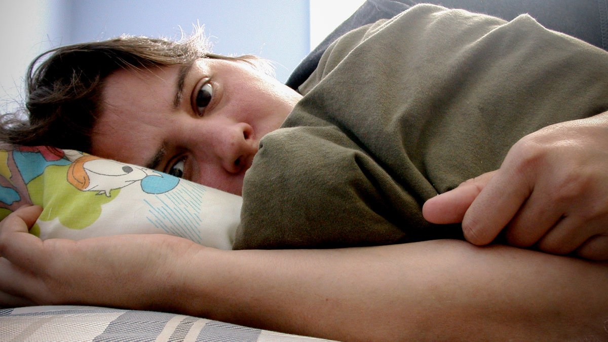 web-man-young-bed-sad-depressed-simon-kellogg-cc