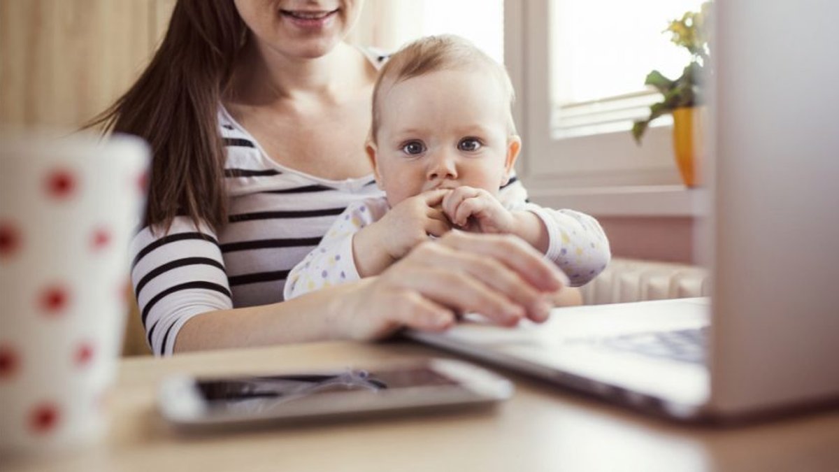 baby and mother at work