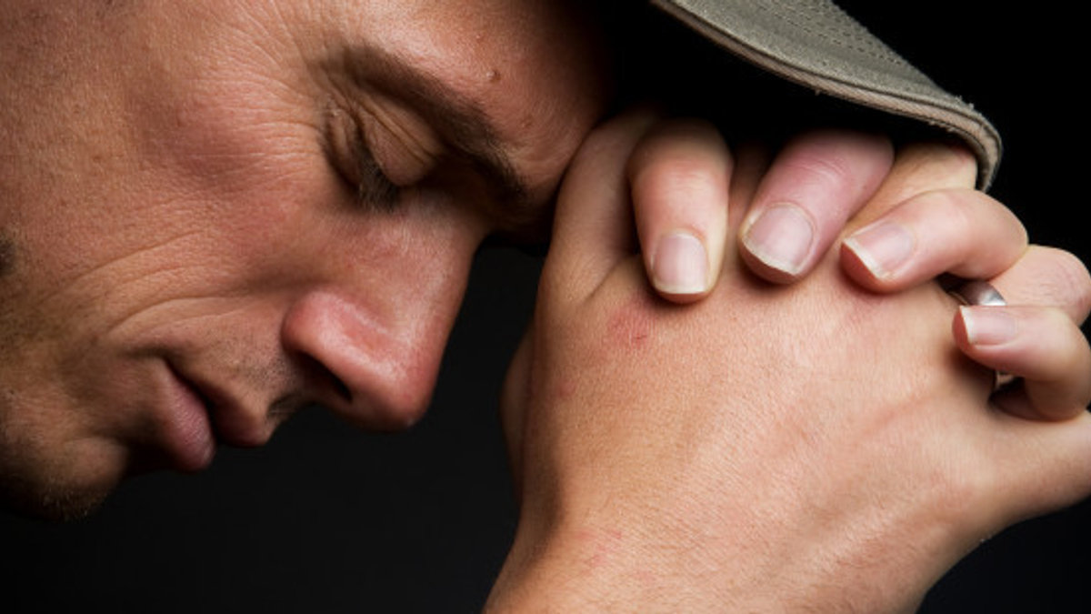 web-man-praying-profile-close-shutterstock-marcel-mooij