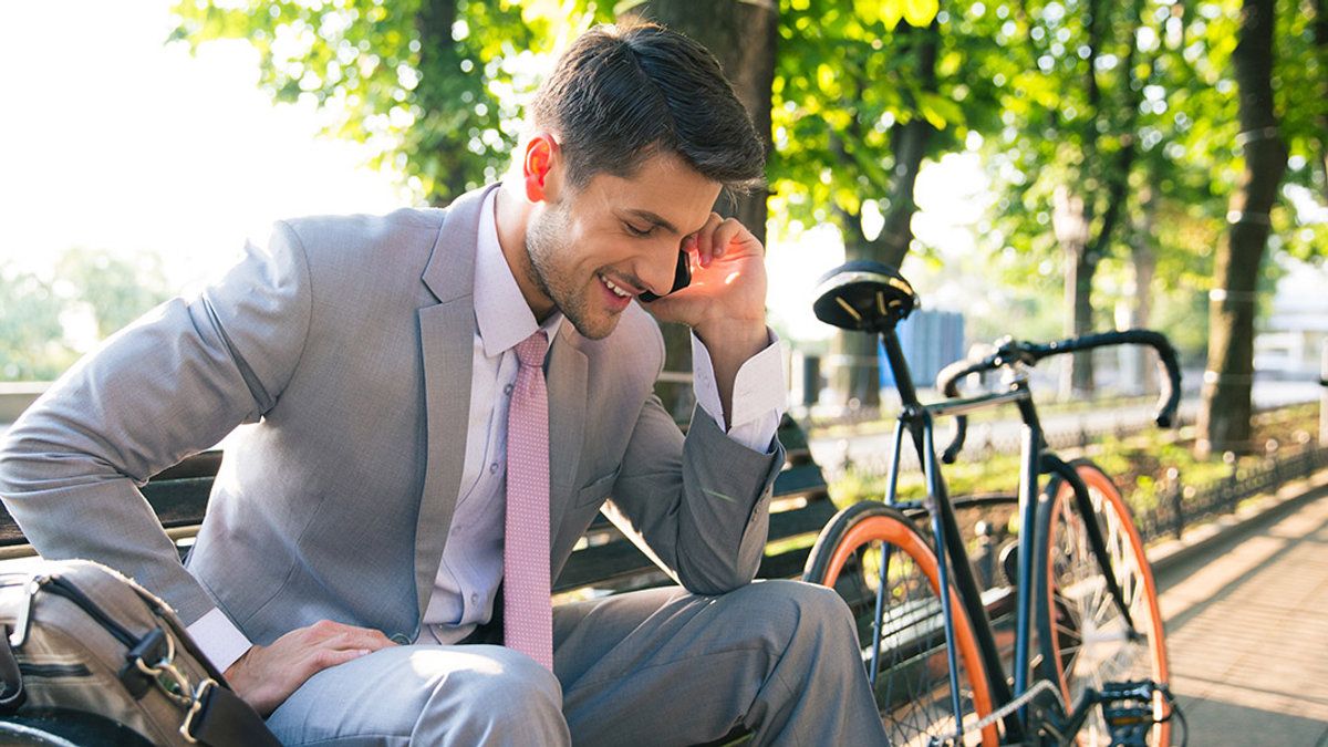 WEB3-HAPPINESS-EXECUTIVE-BIKE-PHONE-Shutterstock_302854991-Dean Drobot-AI