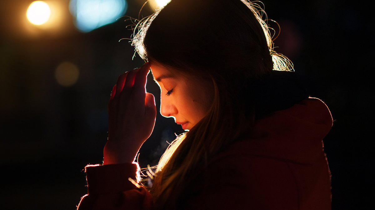 web-woman-praying-night-light-face-tymonko-galyna-shutterstock_404562580