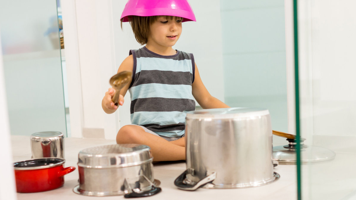 web3-child-playing-drums-kitchen-zurijeta-shutterstock