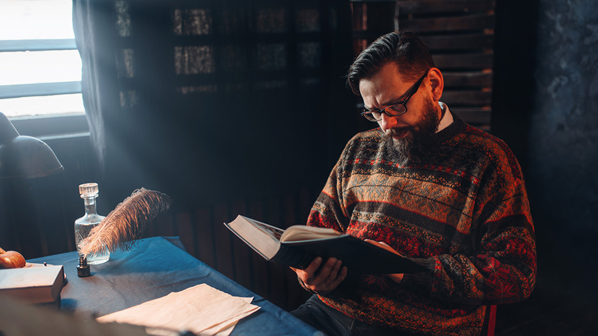 WEB3-MAN-READING-BOOK-RETRO-BEARD-DARK-shutterstock_603373556-Shutterstock