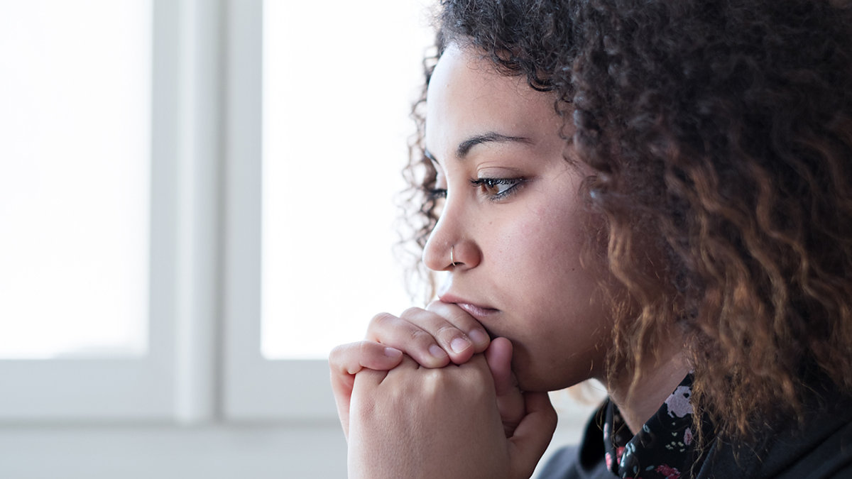 WEB3 AFRICAN AMERICAN WOMAN ANXIETY DEPRESSED SAD HOME Shutterstock