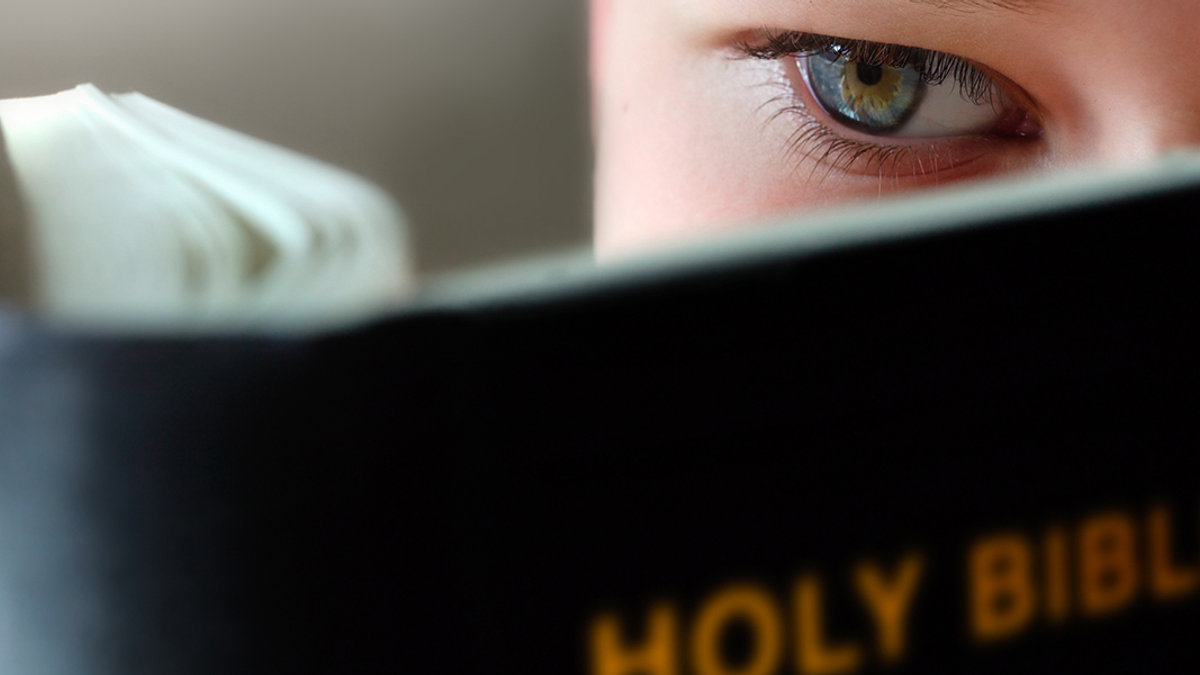 WEB3-CHILD-BOY-READING-BIBLE-EYE-shutterstock_1219452-Shutterstock