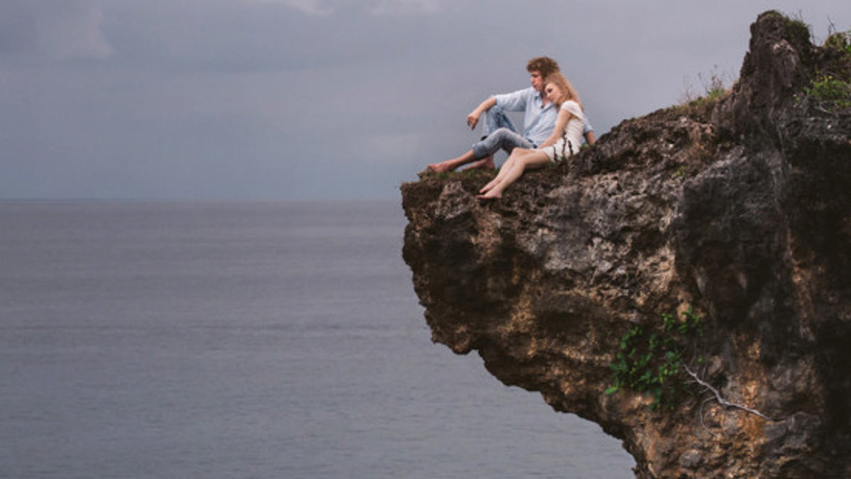 web3-couple-love-cliff-ocean-alexander-grabchilev-stocksy-united