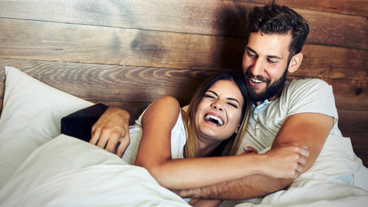 web3-laughing-laugh-husband-wife-bed-love-smiles-shutterstock