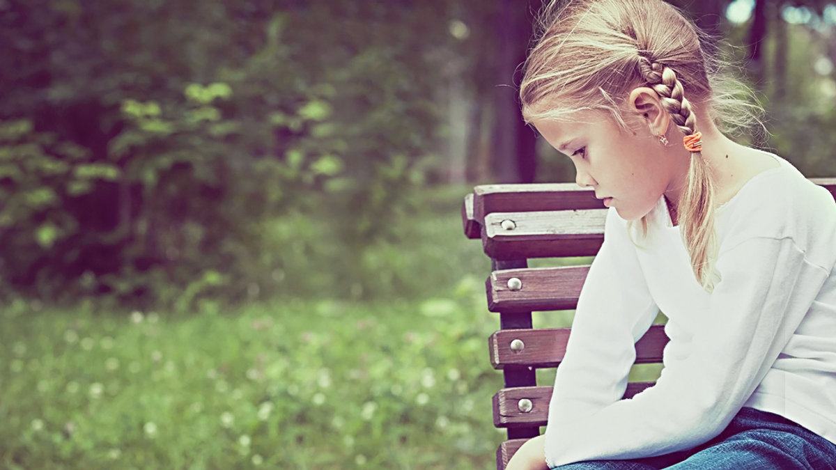 WEB3 LITTLE GIRL SAD BENCH PARK PIGTAILS CHILD Shutterstock