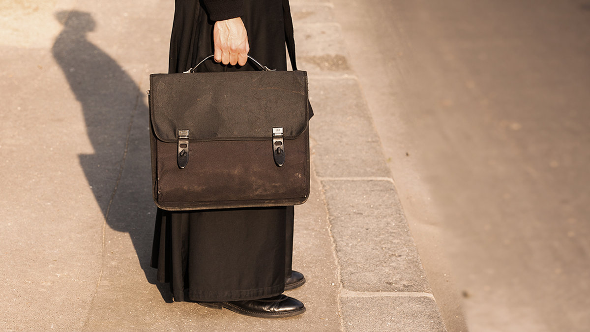 web3-priest-cassock-case-briefcase-shutterstock