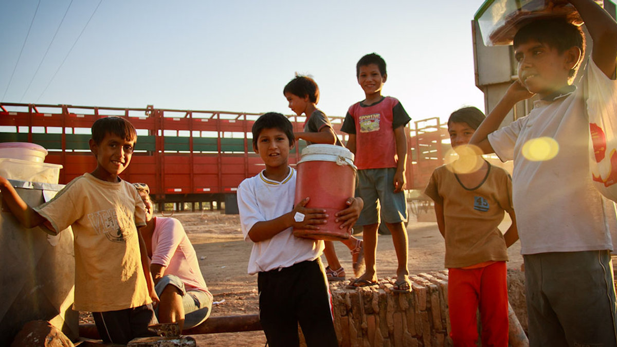 Kids selling food at the bus stop