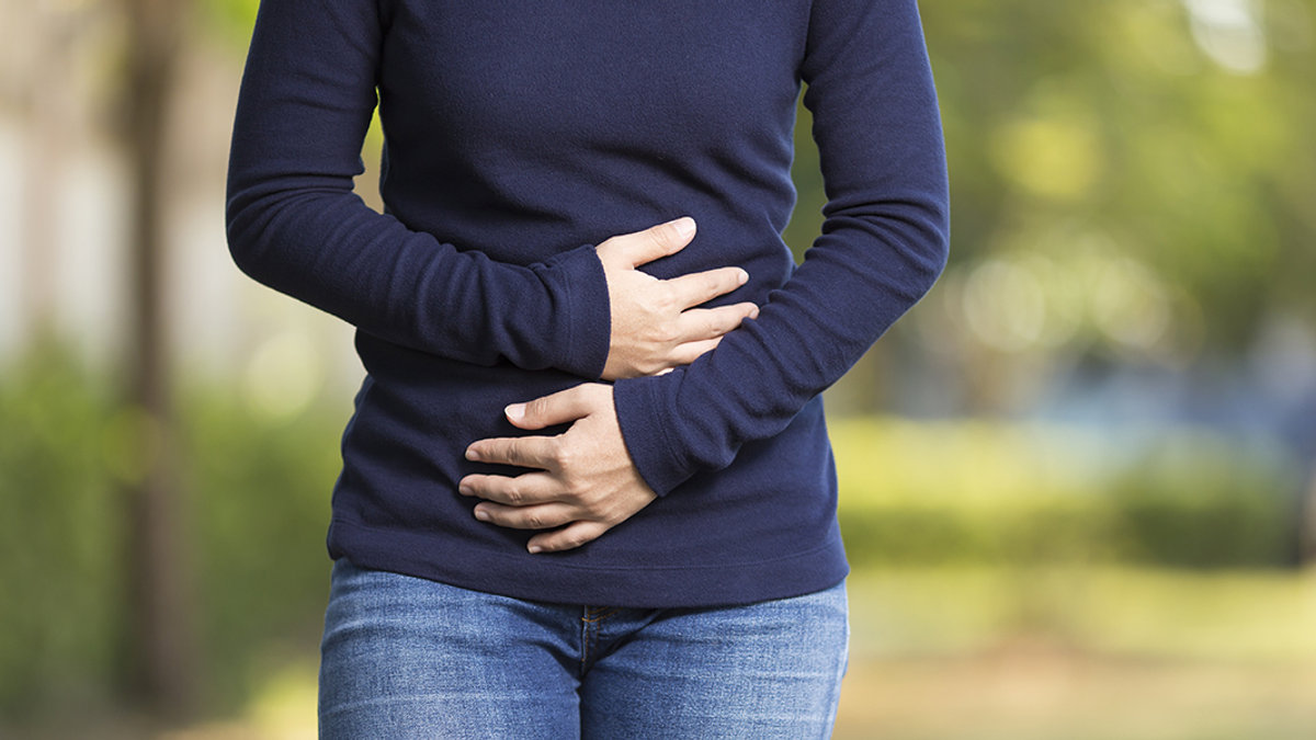 Woman Holding Stomach