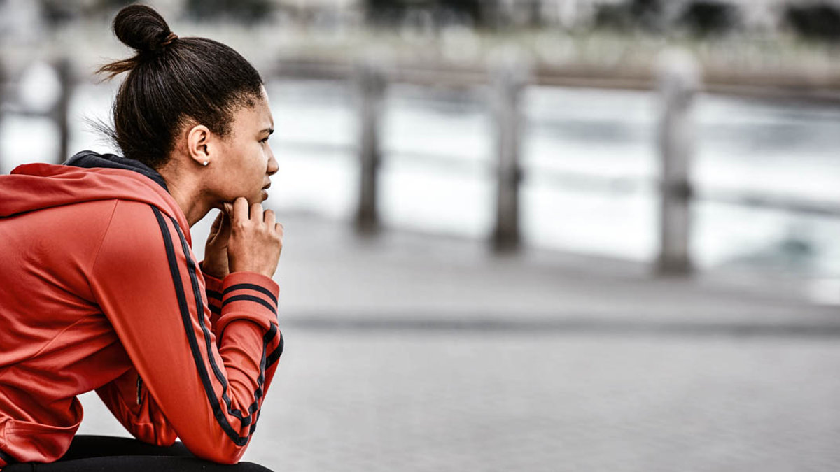 YOUNG WOMAN LOOKING OUT