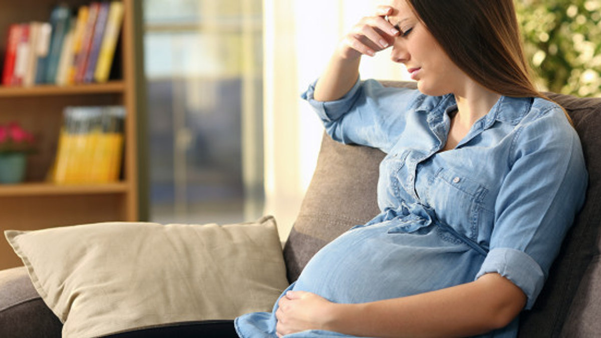web3-upset-woman-pregnant-crying-home-shutterstock
