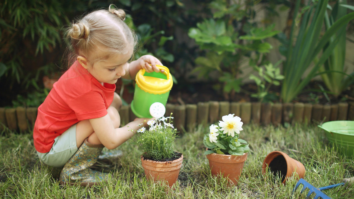 WEB3 LITTLE GIRL GARDEN WORK FLOWERS