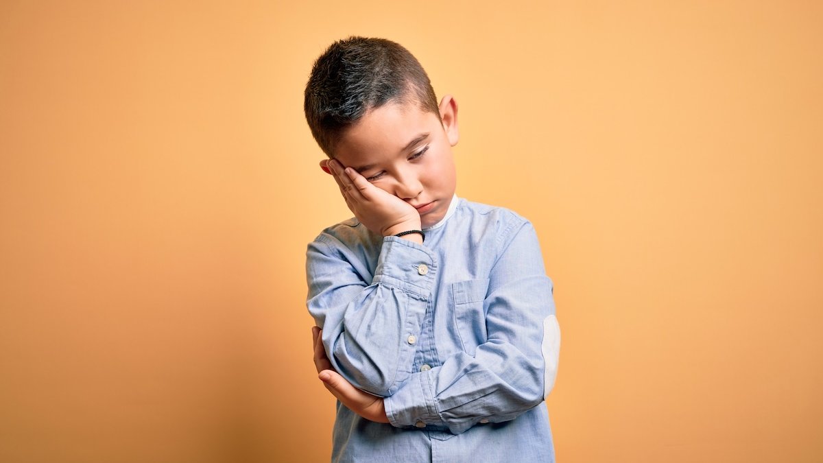 bored-boy-yellow-gold-background.jpg