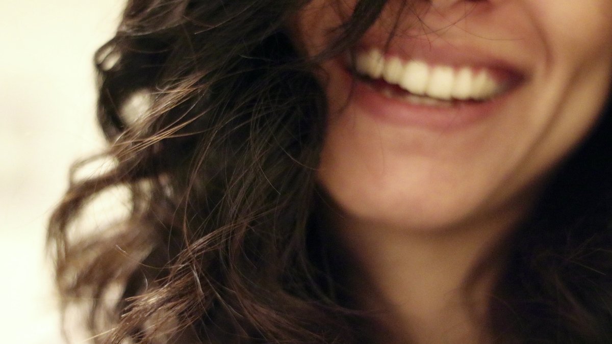 YOUNG WOMAN SMILING