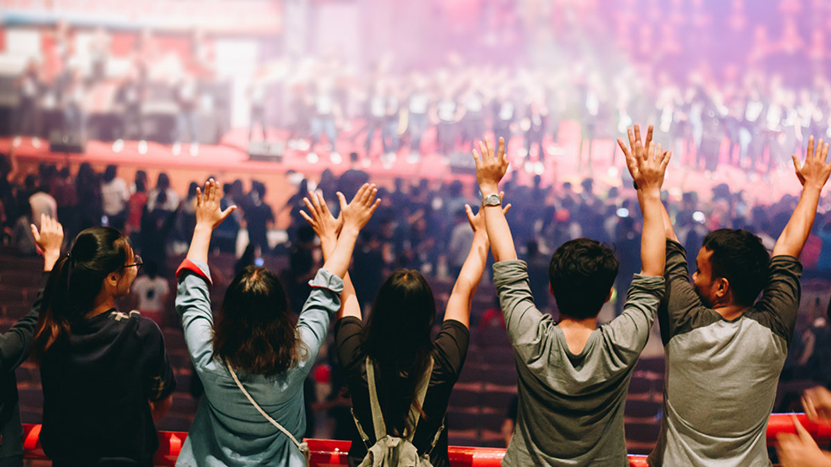young praying raised hand