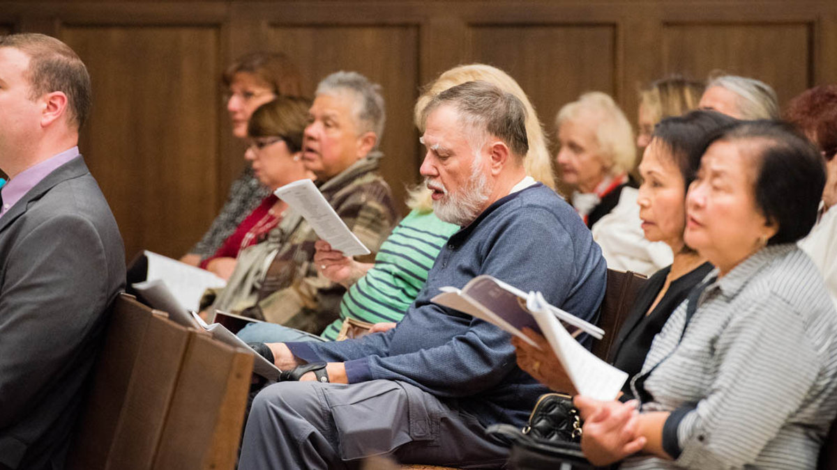 PEOPLE IN PEWS DURING MASS
