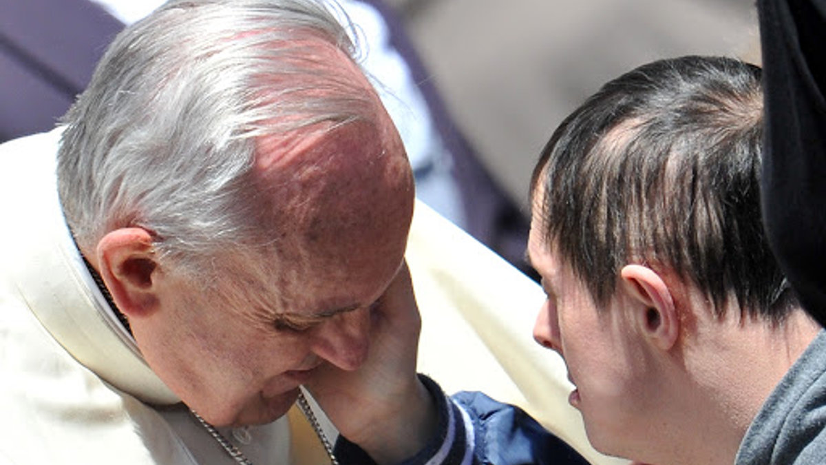 Boy with Down Syndrome caresses Pope Francis