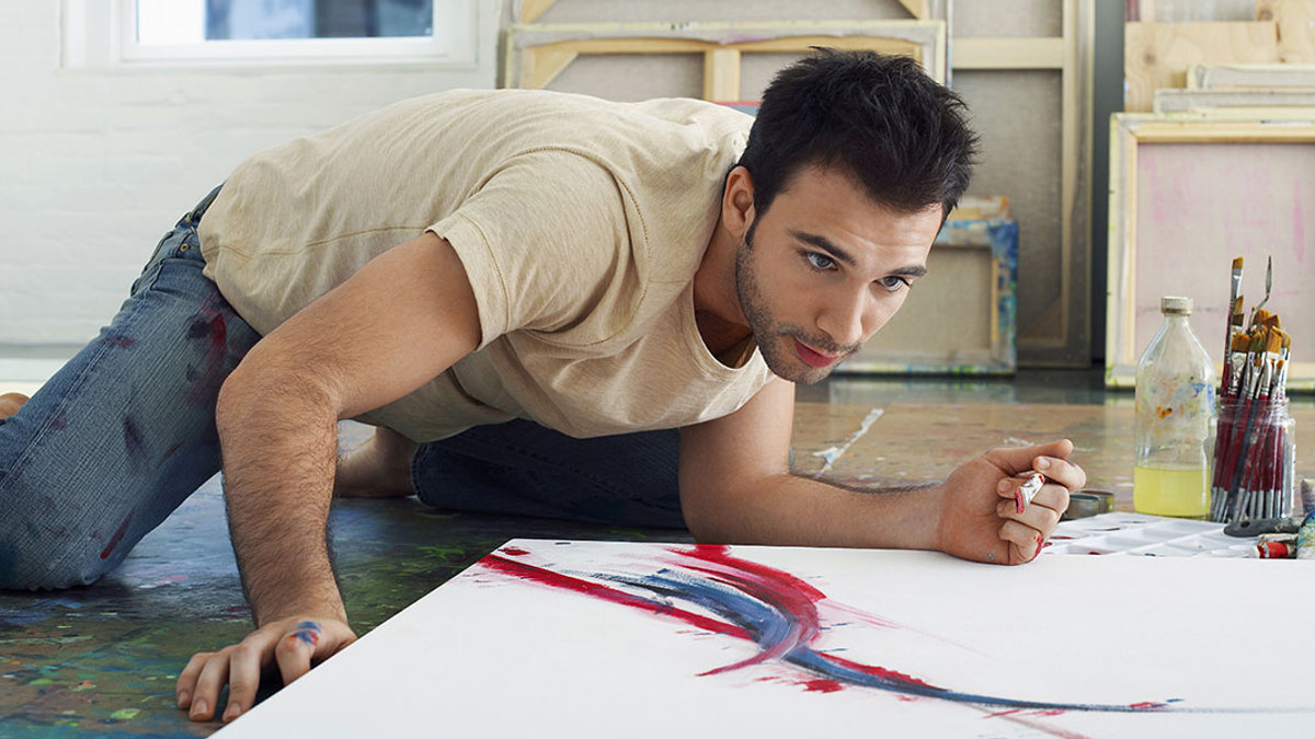 WEB3-YOUNG-MAN-ARTIST-HOMBRE-CANVAS-PAINTING-shutterstock_144811684-sirtravelalot-AI