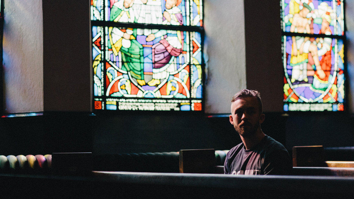 YOUNG,MAN,PRAYING,CHURCH