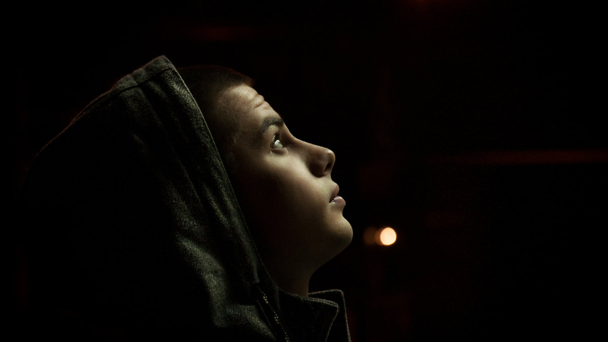 YOUNG MAN DARK BACKGROUND