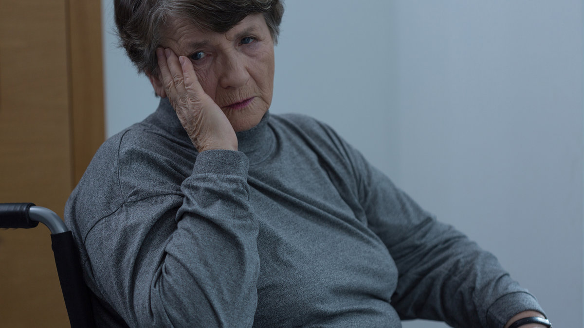aged sad woman wheelchair