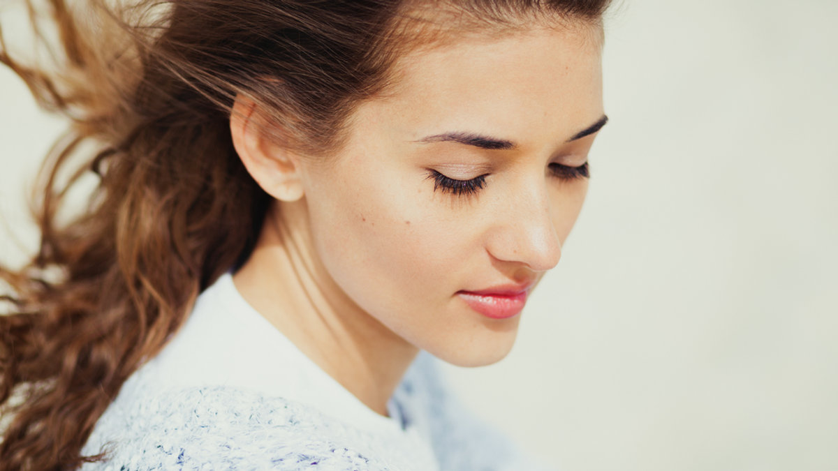 web2-beautiful-woman-enjoing-with-a-fresh-sea-breeze-shutterstock_1028553502.png