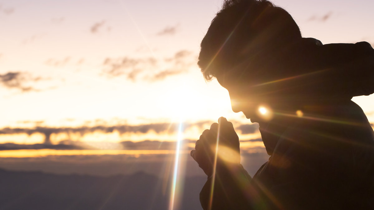 christian man hand praying
