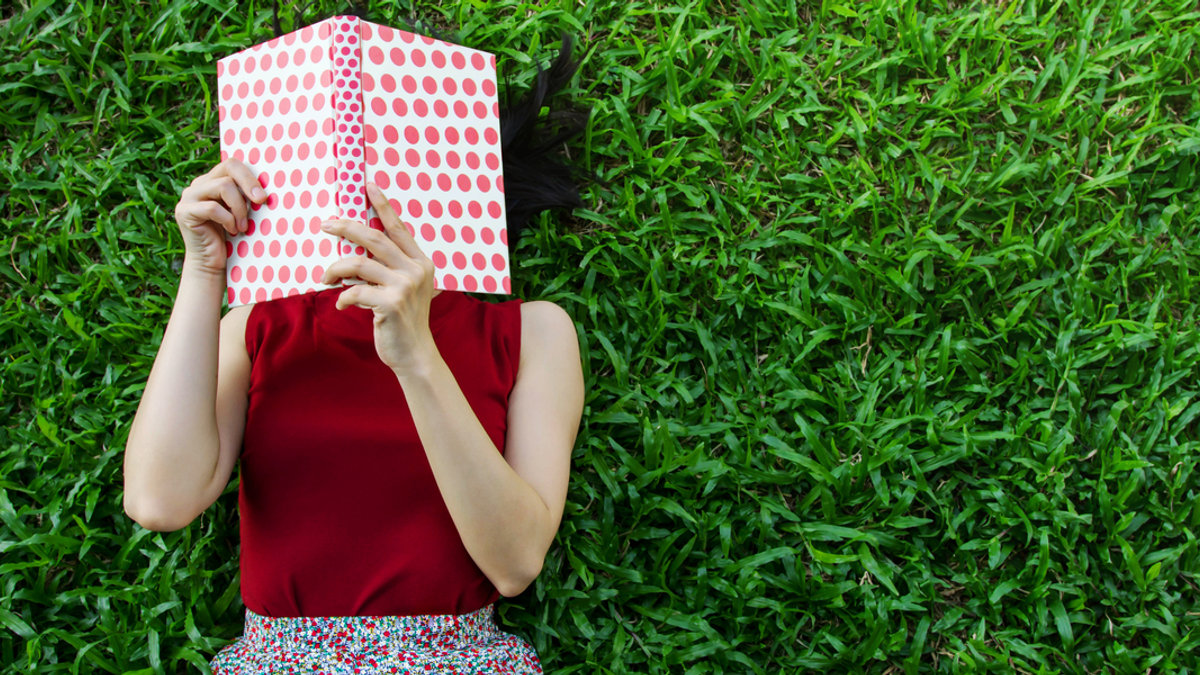 WOMAN, BOOK, GRASS