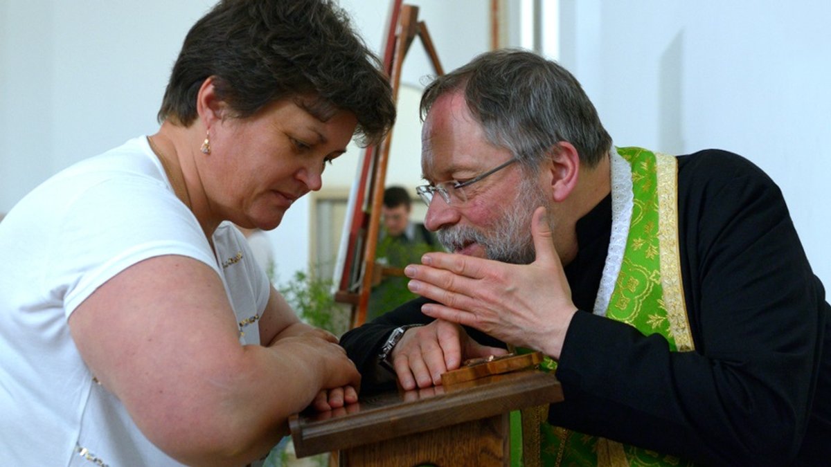 web3-priest-confession-woman-catholic-sacrament-shutterstock-ktrsja.jpg