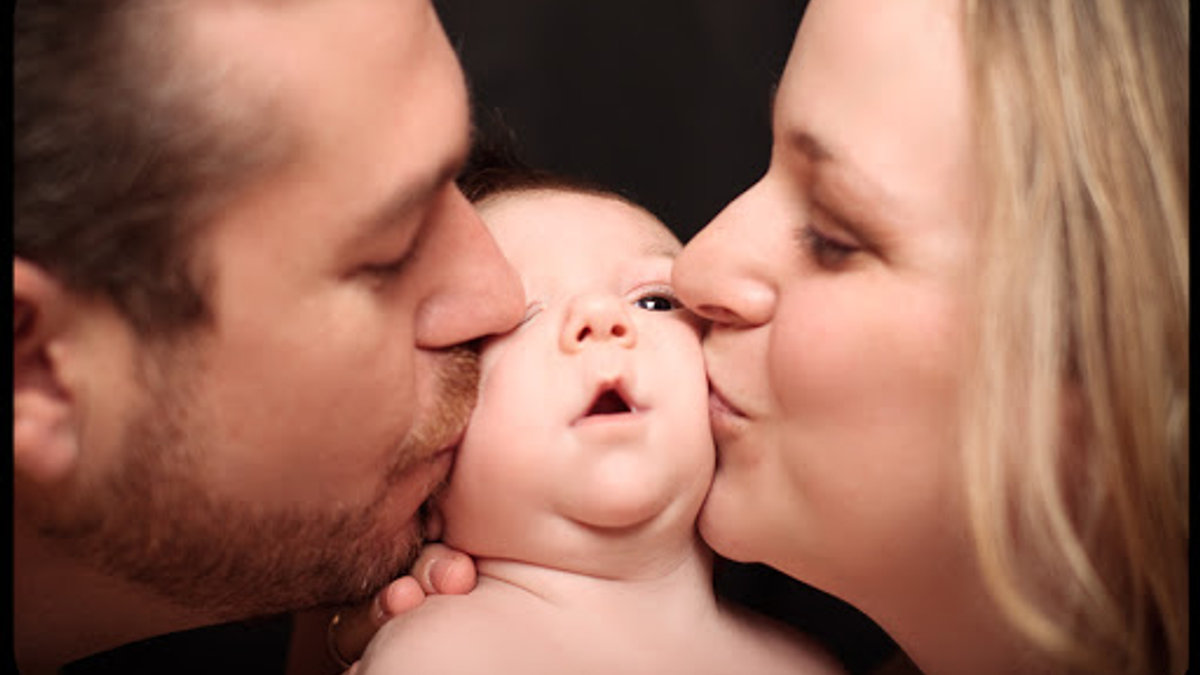 WEB-Mom-Dad-Newborn-Russ-Robinson-CC