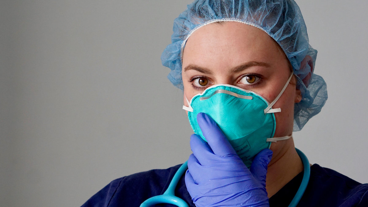 web3-close-up-of-a-female-nurse-putting-on-a-respirator-n95-mask-to-protect-from-airborne-respiratory-diseases-such-as-the-flu-coronavirus-ebola-tb-etc-shutterstock_1625323060.jpg