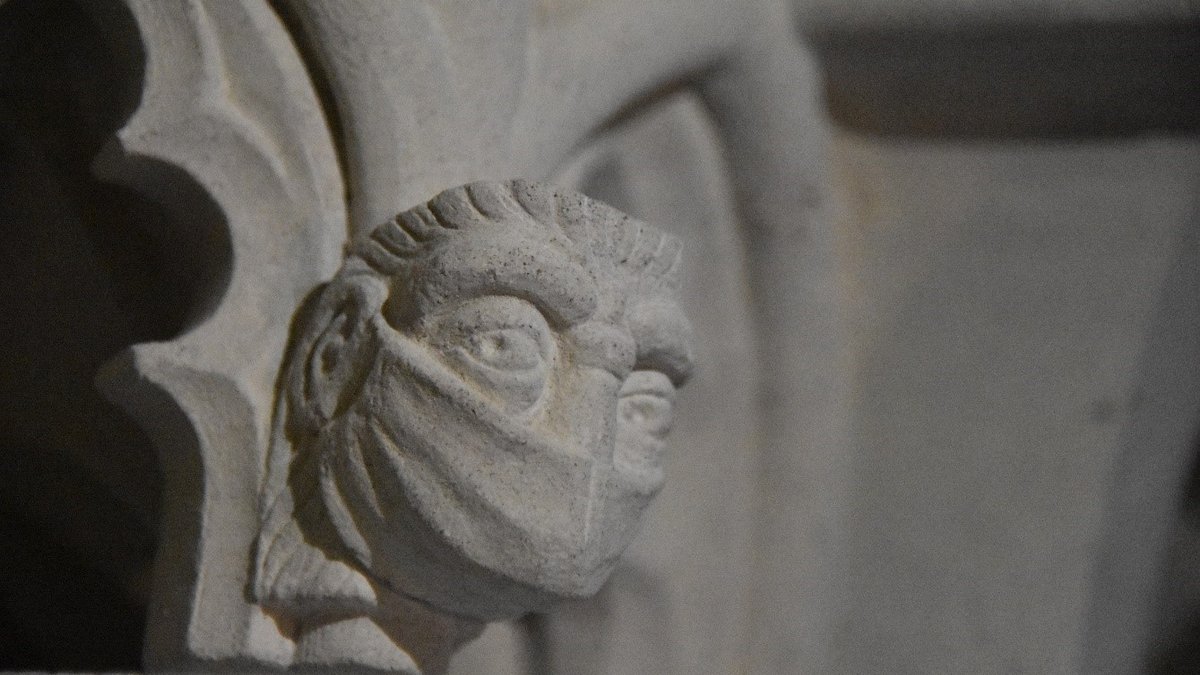 MASKED FIGURE AT THE SHRINE OF ST. AMPHIBALUS