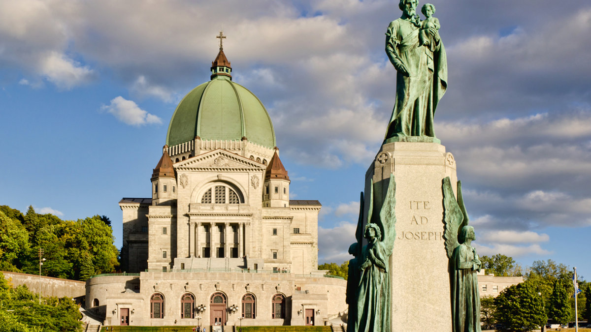 St.Joseph Oratory and St.Joseph monument, at sunset, with cloudy sky