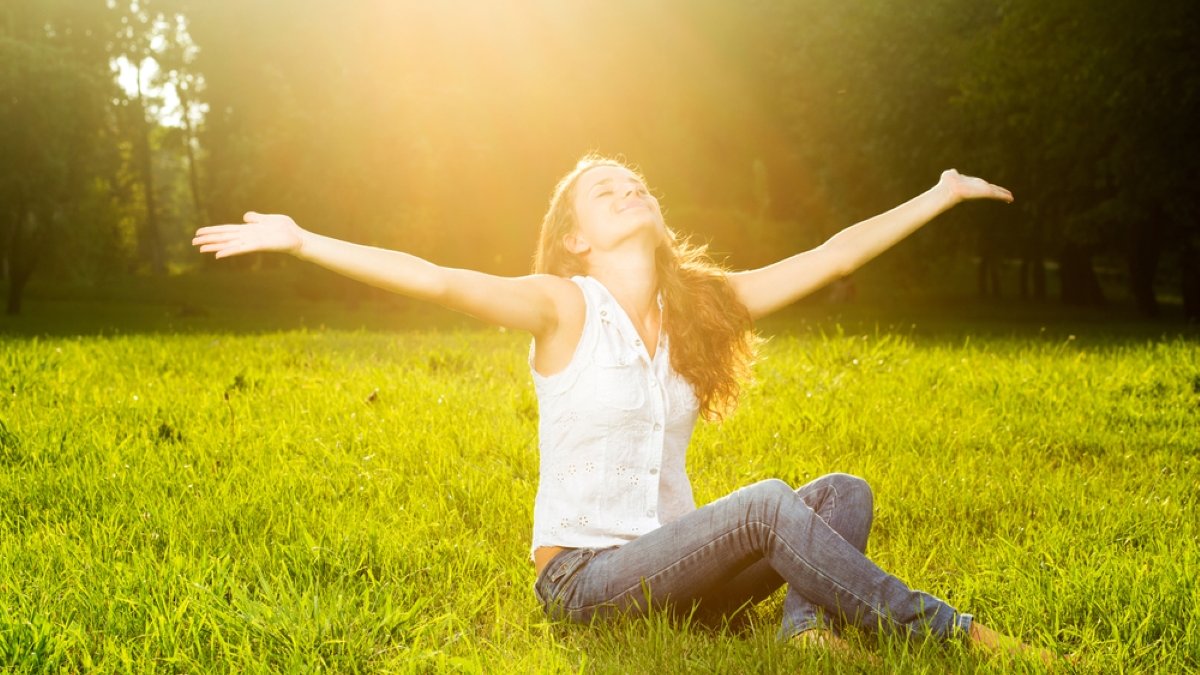 young woman with outstretched arms