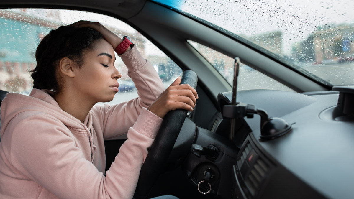 woman distressed car