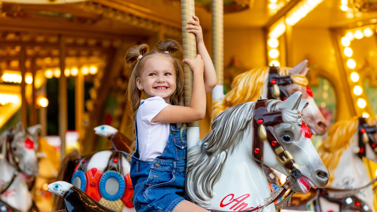 girl smiling carousel