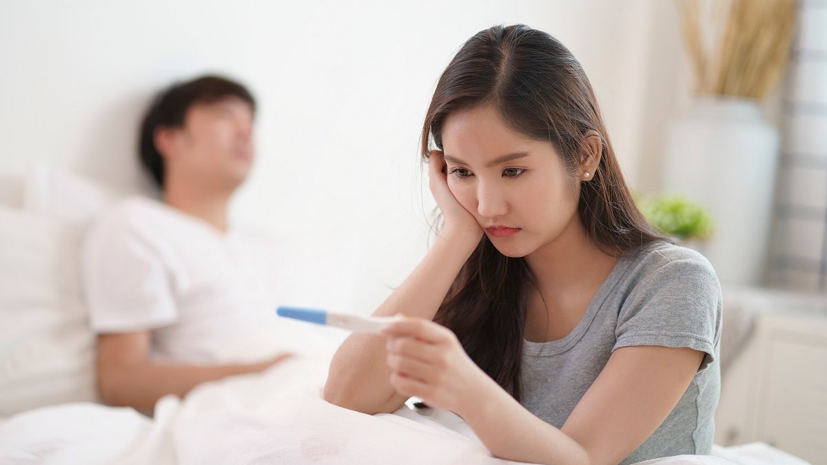 couple in bedroom, infertility