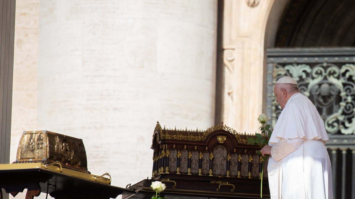 Pope Francis stands by the relics of Saint Therese of Lisieux