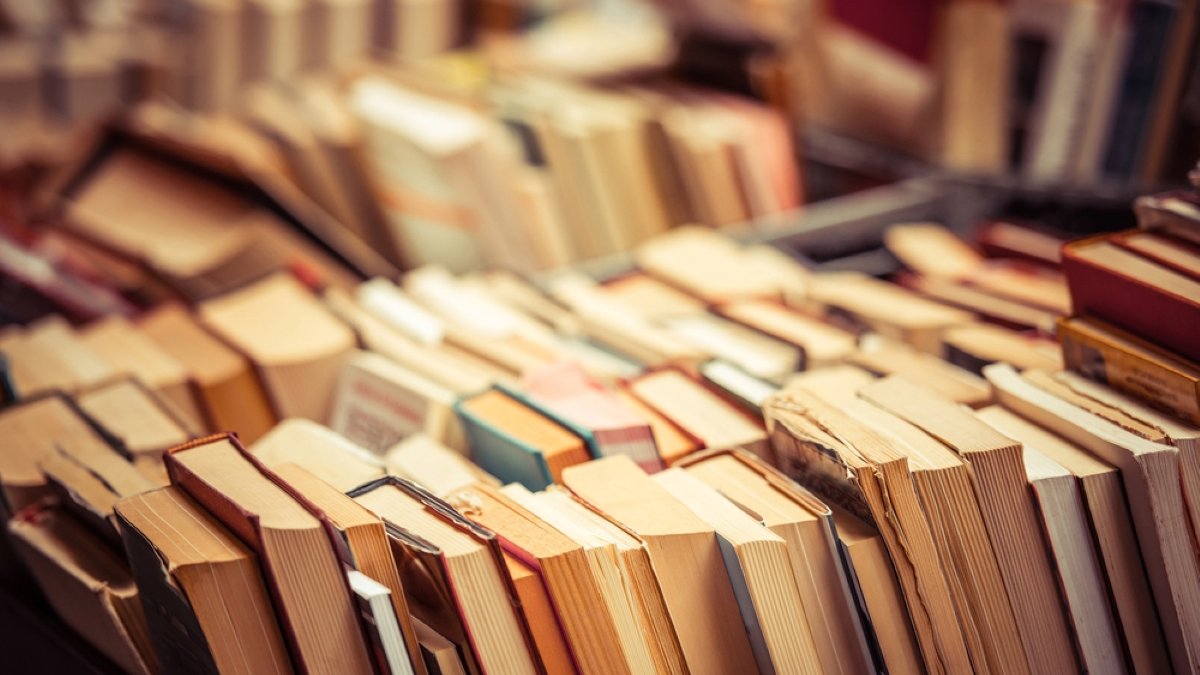 Many old books in a book shop or library