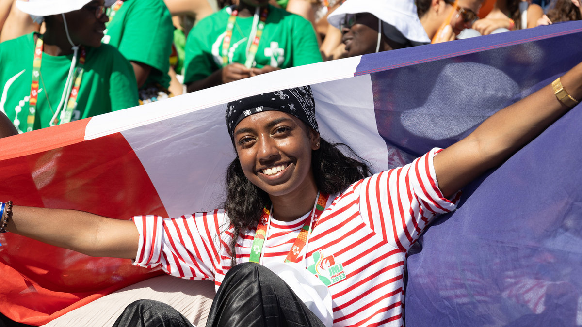 Pilgrims attend the opening mass of the World Youth Day 2023
