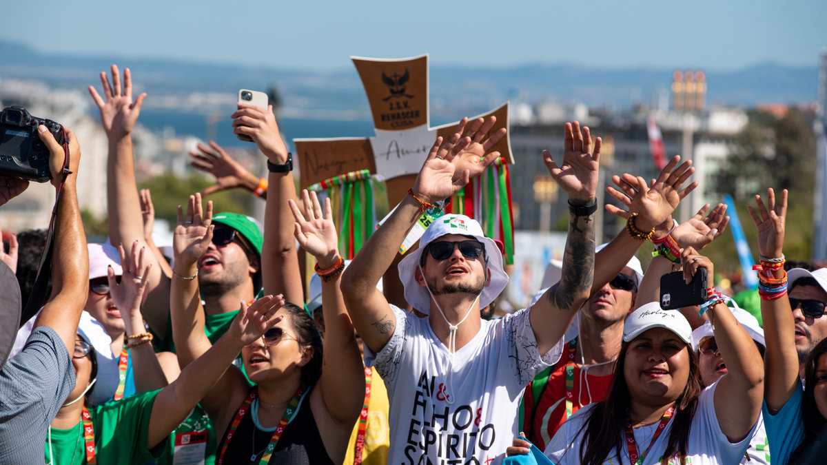 Pilgrims attend the opening mass of the World Youth Day 2023