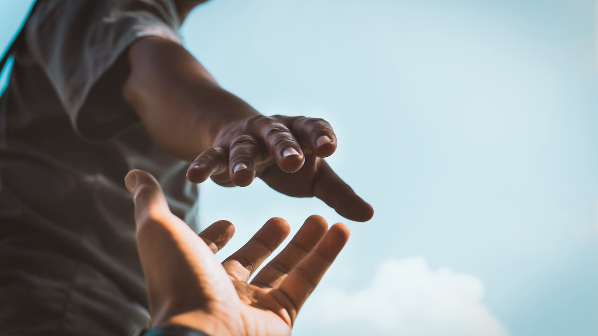 hands reaching Peter
