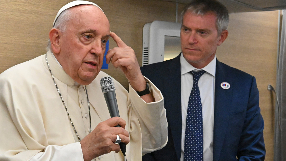 Pope Francis addresses journalists aboard the Papal plane heading to Mongolia on August 31, 2023