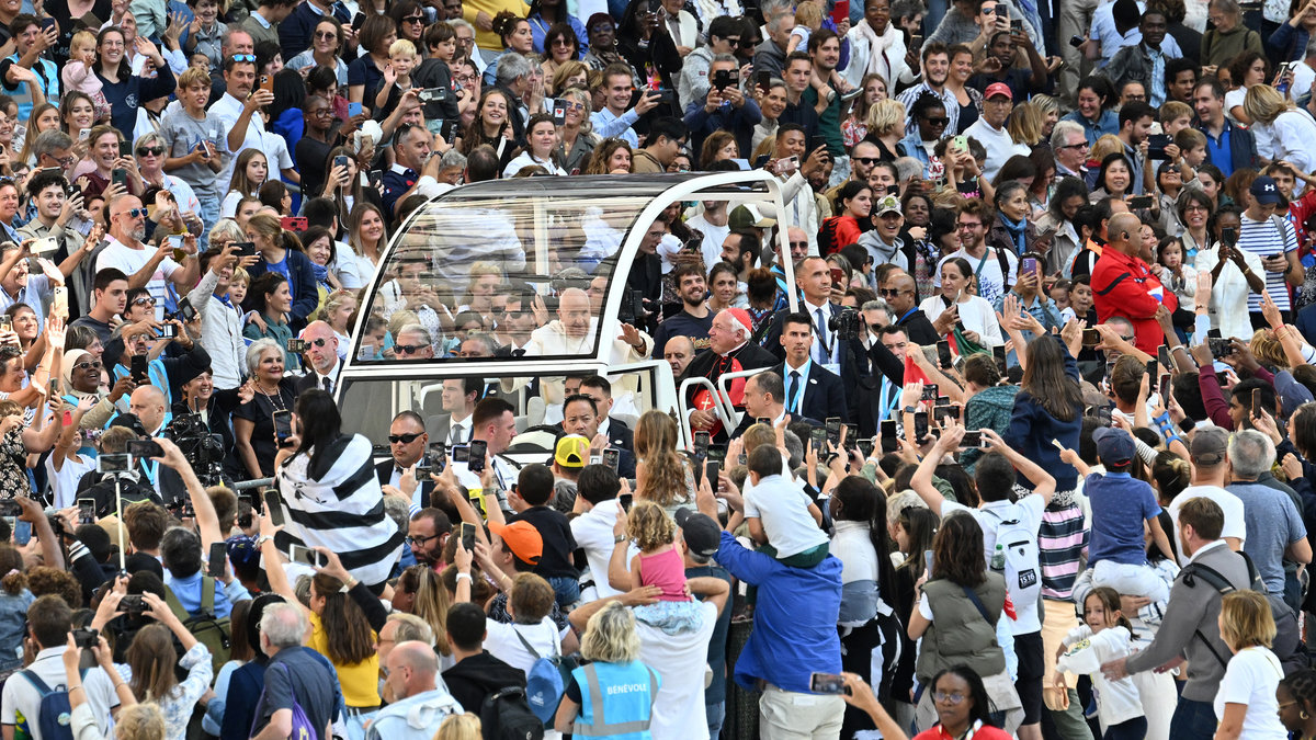 Pope Francis waves as he arrives to celebrate mass at the Velodrome stadium in the southern port city of Marseille