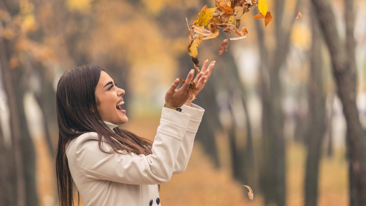 A beautiful young lady having fun in the park
