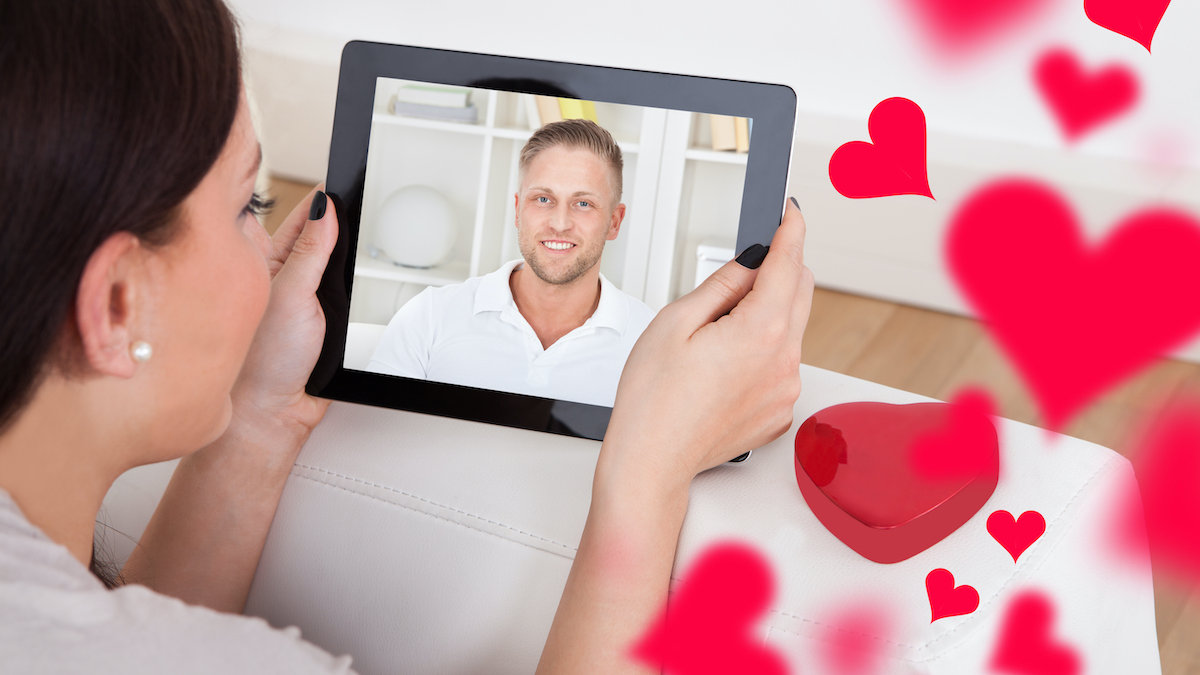 young woman having video chat with boyfriend